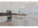 Spacious kitchen with granite countertops and stainless steel appliances at 399 Silver Beach Dr, Daytona Beach, FL 32117