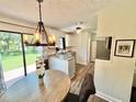 Bright kitchen with granite countertops and island at 322 Canal Rd # A1, Edgewater, FL 32132