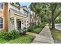 Townhouse exterior with walkway and landscaping at 222 Victoria Commons Blvd, Deland, FL 32724