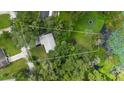 Aerial view showing house location and lot size near a pond at 288 Silverstone Dr, Orange City, FL 32763