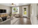 Living room with light-colored furniture and hardwood floors at 2300 Calloway Dr, Orlando, FL 32810
