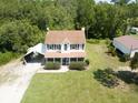 Aerial view of house with detached garage at 4205 Quail Ranch Rd, New Smyrna Beach, FL 32168