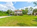 Two story house with green lawn at 4205 Quail Ranch Rd, New Smyrna Beach, FL 32168