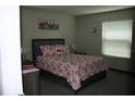 Bedroom with flamingo bedding and window blinds at 916 Spanish Ln, Deland, FL 32720