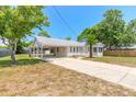 Single story house with carport and spacious yard at 305 Fox Pl, Port Orange, FL 32127