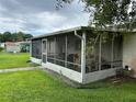 Large screened porch, perfect for relaxing outdoors at 1612 Juno Trl, Astor, FL 32102