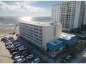 Aerial view of beachfront property, showing building and parking at 2043 S Atlantic Ave # 308, Daytona Beach, FL 32118