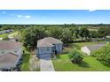 Two-story house with blue exterior and a spacious yard at 3149 Mandeville St, Deltona, FL 32738