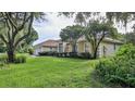 Single-story home with lush landscaping and a large yard at 3709 Donegal Cir, Ormond Beach, FL 32174