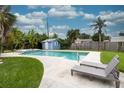 Inviting backyard pool with lounge chairs and shed at 2100 Brian Ave, South Daytona, FL 32119