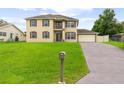 Two-story house, large lawn, driveway, and mailbox at 2291 Henry Ln, Deltona, FL 32738