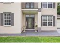Front entry with double door and decorative urns at 2291 Henry Ln, Deltona, FL 32738
