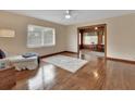 Spacious living room featuring hardwood floors and a comfy lounge chair at 1402 Talton Ave, Deland, FL 32720
