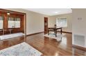 Bright dining room with hardwood floors and a vintage table at 1402 Talton Ave, Deland, FL 32720