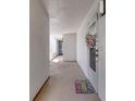 Bright hallway with access to condo unit and amenities at 1 John Anderson Dr # 1070, Ormond Beach, FL 32176