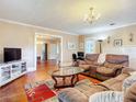 Bright living room with hardwood floors, comfortable seating and a fireplace at 263 S Center St, Pierson, FL 32180