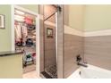 Bathroom with walk-in closet, soaking tub, and shower at 3836 Long Grove Ln, Port Orange, FL 32129