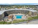Aerial view of oceanfront building with pool at 2301 S Atlantic Ave # 236, Daytona Beach Shores, FL 32118