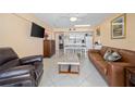 Open concept living room with comfortable seating and ocean view at 2301 S Atlantic Ave # 306, Daytona Beach Shores, FL 32118
