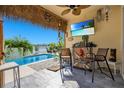 Tropical-themed pool area with tiki bar and lake view at 260 Jackson Loop, Deland, FL 32724