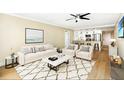 Living room with hardwood floors, stylish furniture, and an open kitchen at 2947 S Atlantic Ave # 301, Daytona Beach Shores, FL 32118