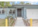 House entrance with ramp access and freshly painted siding at 333 Beresford Ave, Deland, FL 32724