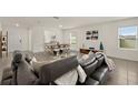 Open concept living and dining area with modern furniture at 370 Sunset Point Dr, Ormond Beach, FL 32174