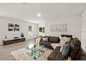 Bright living room with sectional sofa and glass coffee table at 370 Sunset Point Dr, Ormond Beach, FL 32174