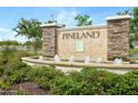 PineLand community entrance with water feature at 370 Sunset Point Dr, Ormond Beach, FL 32174
