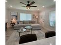 Bright living room with a sectional sofa and modern decor at 1140 S Orlando Ave # F-16, Maitland, FL 32751