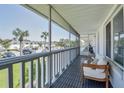 Relaxing screened porch with seating and view of the community at 1140 S Orlando Ave # F-16, Maitland, FL 32751