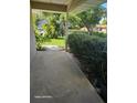 Covered front porch with a view of the nicely landscaped yard at 1461 N Felton St, Deltona, FL 32725