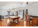 Game room with pool table, wet bar, and hardwood floors at 900 Riverside Dr, Daytona Beach, FL 32117