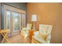 Inviting front porch with two armchairs and a side table at 5411 Canna Ct, Port Orange, FL 32128
