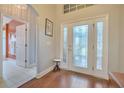 Bright entryway with hardwood floors and a view of a bathroom at 5411 Canna Ct, Port Orange, FL 32128