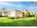 House exterior showcasing a well-maintained lawn and landscaping at 1401 Palisades Ln, Deland, FL 32724