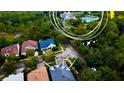 Aerial view of a house in a residential neighborhood with a community pool nearby at 101 Avenham Dr, Deland, FL 32724
