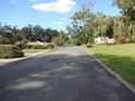 Quiet residential street with mature trees and well-maintained homes at 770 Lancaster Rd, Deland, FL 32720