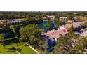 Aerial view of condo community near lake, highlighting a specific unit at 1 Escondido Cir # 174, Altamonte Springs, FL 32701