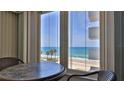 Ocean view from a condo with a table and chairs at 2987 S Atlantic Ave # D060, Daytona Beach, FL 32118