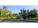 Peaceful pond view with lush greenery and white ibis birds at 1630 Primo Ct, Daytona Beach, FL 32117