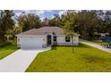 Newly constructed one-story home with a modern design and stone accents at 2202 Spruce St, Deland, FL 32724