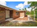Brick house exterior with a front entrance and landscaping at 660 Saxon Blvd, Deltona, FL 32725