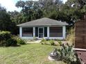 White single-story house with small yard at 950 S Parsons Ave, Deland, FL 32720