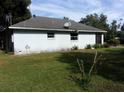 Rear view of a white single story house at 950 S Parsons Ave, Deland, FL 32720