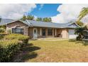 Brick house with attached garage and landscaping at 1020 Hanford Dr, Deltona, FL 32738