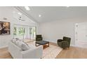 Bright living room with a large window and comfortable seating at 1873 Spruce Creek Blvd, Port Orange, FL 32128