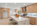 Modern kitchen with stainless steel appliances and light wood cabinets at 1873 Spruce Creek Blvd, Port Orange, FL 32128