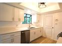 Modern kitchen with white cabinets and quartz countertops at 1899 S Lehigh Dr, Deltona, FL 32738