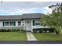 Front view of a charming house with green shutters and a neatly landscaped yard at 201 N Hill Ave # 150, Deland, FL 32724